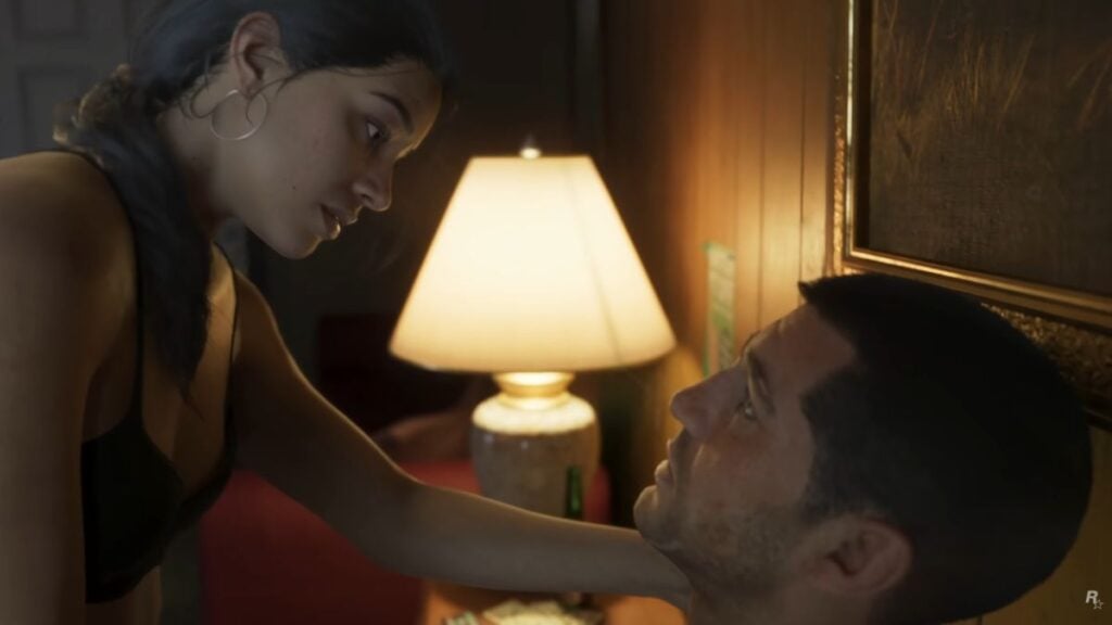 The inside of the Starlet Motel, with Jason and Lucia on the bed.