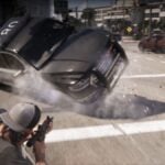Jason shoots at a police car in GTA 6, causing its tires to pop and for it to flip over.